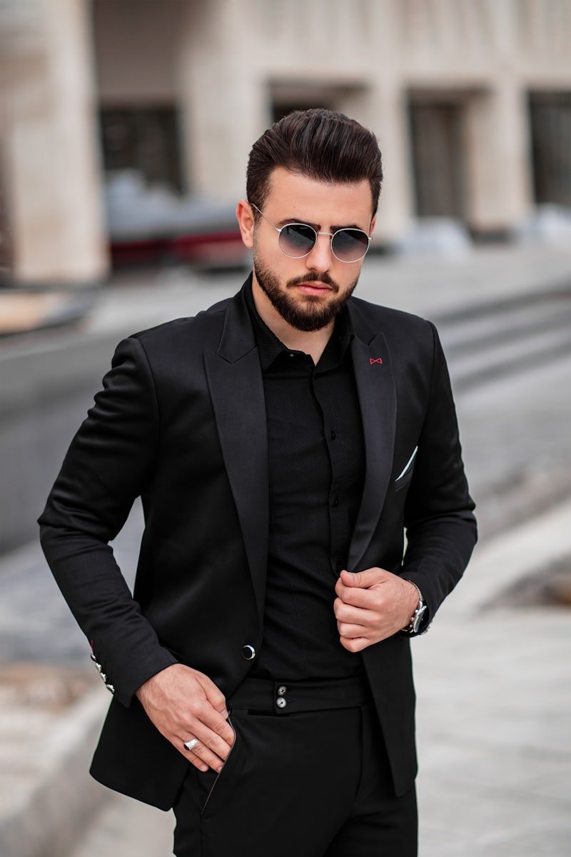 Charcoal grey three-piece suit with sleeve shortening and waist suppression